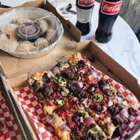 Vegan pizza (vegan cheese and sausage) with vegan knots! So good!  at Guerrilla Pizza  in Las Vegas