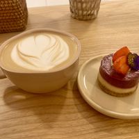 Hot latte and tangy lemon raspberry mini cake  at Rawberry in Ho Chi Minh City