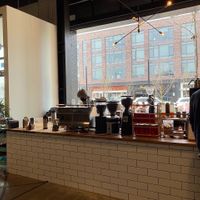 Interior counter opens to outdoor seating and service counter  at Rising Star Coffee Roasters in Shaker Heights