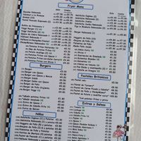 Menu with vegan (VG) and vegetarian (V) options labeled in green. at Gigi's Chippy Diner in Menorca