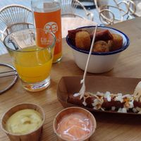 Frikandel (already took one bite!) & 12 piece snack platter (bitterballen, spicy egg rolls & deep fried cheese) at Last Vegas in Utrecht