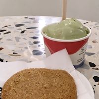 Pandan gula melaka ice cream and an almond oatmeal cookie at Kind Kones - Paragon Orchard in Central Singapore