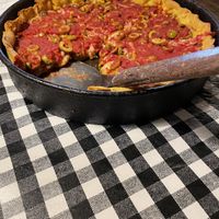 Vegan cheese deep dish with green olives  at Gino's East in Wheaton