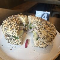 Everything bagel with garlic herb cream cheese, cucumber, onion at Apothica Cafe in Cumberland