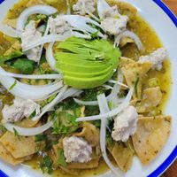 Green chilaquiles with almond ricotta at La Cueva del Chango in Playa Del Carmen