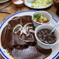 3 enchilada in mole  at La Cueva del Chango in Playa Del Carmen