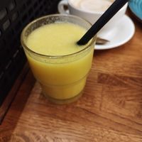 Freshly squeezed orange juice and if you look closely you can also see the melange with oat milk at Das Vivet in Vienna