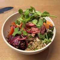 Big salad bowl with a lot of fresh veggies and colourful dips  at Café Glad in Aarhus