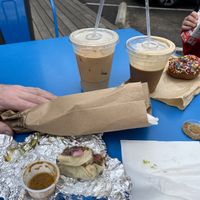 V taco ($3) from Tacodeli, Cold Brew w/ Half & Half ($4.15), Moon Raker w/ Oat milk ($5.40) Honest juice ($1) Chocolate sprinkles donut ($3). Total $21.50 w/tips   at Summer Moon Coffee - W Anderson Ln in Austin