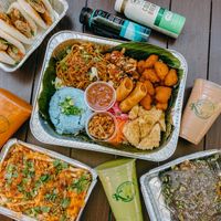 Table spread with Banana leaf platter, chikn Bao, v fires, and jianbing  at K Tea Cafe in Sunnyvale