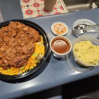 Sitting at USO in airport, ordered Uber eats. BBQ  Jackfruit on a baked potato and potato salad. at Central Texas Style BBQ in Pearland