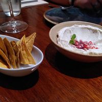 Fermented Cashew Cheese with pomegranate and nachos, simply amazing! at PÖTSTOT in Barcelona