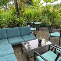Patio seating covered from the rain at Maui Garden Grove Cafe in Haiku