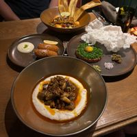 Cocido (front), croquettas (middle left), tartare (middle right), moqueca (back)  at Lona Misa in South Yarra