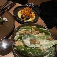 Caesar salad and mutton skewers on a corn purée    at Lona Misa in South Yarra