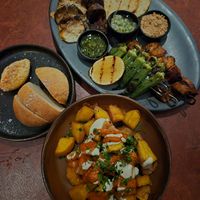 Parrillada 56: overpriced!! didn't enjoy the chikn, lions mane, or chorizo texture, okra, chimichurri, + pico de gallo was nice; Potato bread+butter 12 + Patatas bravas 18: delish at Lona Misa in South Yarra