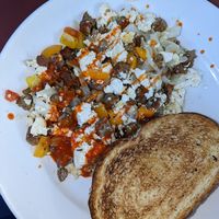 Create your own scramble (tofu, mushroom, onion, peppers, veggie sausage) - I added hot sauce at Cafe This Way in Bar Harbor