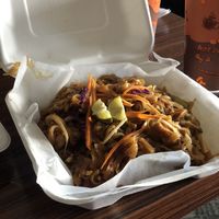 Pad Thai with Thai ice tea in the background  at Thai Vegan in Albuquerque