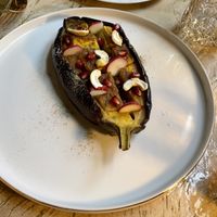 Starter: aubergine with mango and turmeric powder and pomegranate seeds   at Vrindaa in Rome