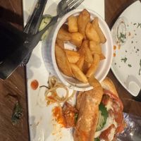 Buffalo chicken sandwich and steak fries   at Bar Vegan ATL in Atlanta