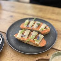 Torrada pa amb tomàquet i formatge de pebre  at Herbivore Plant Based & Fermented Food in Reus