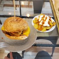 Onion ring burger + bravas at La Golosa Vegan Vurger in Barcelona