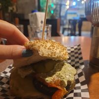 Burger with avocado sauce, vegan cheese and more at La Golosa Vegan Vurger in Barcelona