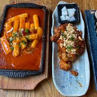 Homemade ginger lemonade, tteokbokki,  fried cauliflower wings with pickled radish, and bulbossot kimbap 😍  at Kini in Hamburg