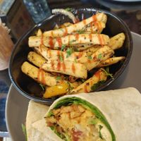 Jerk fries and breakfast burrito   at Scoff's in Horsforth