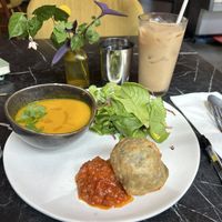 “Samosa & Soup” - carrot soup, saag samosa, salad. Almond iced chai masala.  at PONDiCHERi Bake Lab in Houston