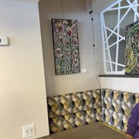 Paintings on sale on the wall   at Good Eats Cafe in Ottawa