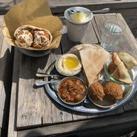 Top Left: KMÄSCH (Pitabread filled with lettuce,              falafel, bulgur and muhamarra).                                           Bottom right: Hummus, Muhammara, Falafel... at Kleine Freiheit in Zurich