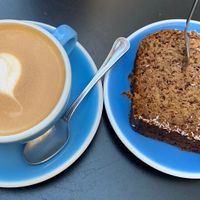 Tasty almond milk Cappuccino and vegan coconut bread.  at Lot Sixty One Coffee in Valletta