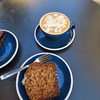 Cappuccino and vegan coconut bread. at Lot Sixty One Coffee in Valletta