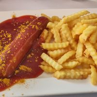 Vegane Currywurst mit Pommes at Café Waltenbergstüberl in Seeon