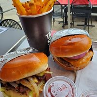 OG burger, BBQ bacon burger, and fries at Stand-Up Burgers - Diversey in Chicago