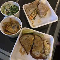 Salad, poutine, Buffalo “chicken” wrap and Reuben Delivered right to our hotel airport room. 10/10. at Fresh Kitchen + Juice Bar Hurontario in Mississauga