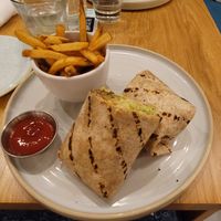 One of the wraps with a side of fries at Fresh Kitchen + Juice Bar Hurontario in Mississauga