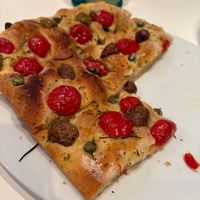 Focaccia with tomatoes, olives and capers at The Rolling Pin Cooking School in Padua