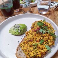 Simply sourdough + scrambled silken tofu with extra avocado and green remedy smoothie at nue ground in South West London
