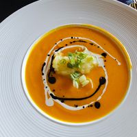 Creamy carrot soup w 'potato cream' in center (gluten free) at Ka Papa Cuisine in Sarasota