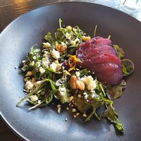 Poached pear and 'blue cheese' salad w caramelized walnuts, arugula, and port wine balsamic vinaigrette dressing (gluten free)  at Ka Papa Cuisine in Sarasota