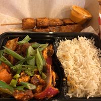 Dynamite tofu (front), Potatoes - street stick food (back)  at CAFEMANDU in Irving