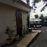 Side of the cafe leading to the outdoor seating at the back  at Pengohoda - 펜고호다 in Jeju
