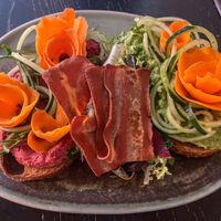 Avocado and beetroot toast with vegan baconn  at Faire Brunch & Drinks in Barcelona