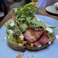 Avocado toast, with tofu scramble and vegan bacon  at Faire Brunch & Drinks in Barcelona