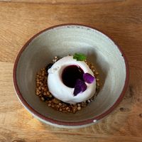 Dessert of elderflower ice cream, mixed berry coulis and mixed grain crumb at Bistro Lupa in Copenhagen