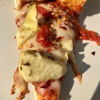 Daiya cheeze, artichoke hearts & sun dried tomatoes at Woodstock's Pizza in Davis