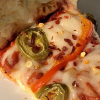 Daiya cheeze, bell peppers & jalapeños  at Woodstock's Pizza in Davis