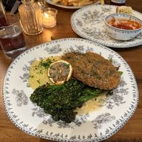 Chicken piccata with potato puree and broccolini  at DC Vegan in Washington